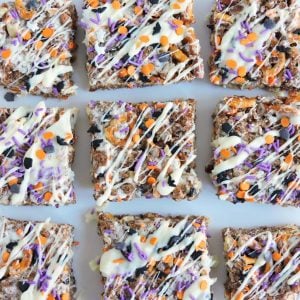 Crunchy Almond Halloween Bars- Chocolate rice krispie treats with almonds and pretzels, drizzled with halloween sprinkles and white chocolate