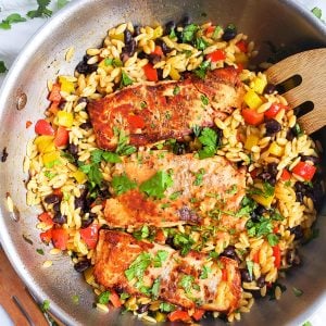 Southwestern Salmon and Orzo made with black beans, corn, red bell peppers, and Marie's Market Reserve Southwest Style Ranch Dressing in a large pan