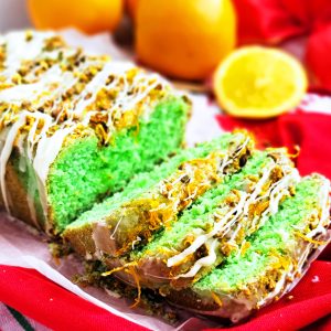 Easy green Grinch Cake made with oranges and pistachios, perfect for Christmas and the holidays. Recipe by beautifuleatsandthings.com