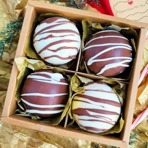 These Decadent Hot Chocolate Bombs (hot cocoa bombs) make the perfect DIY holiday gift. Packaged in a cardboard container, drizzled with white chocolate and milk chocolate. beautifuleatsandthings.com