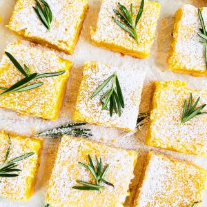These Easy Rosemary Lemon Bars are made with a soft, shortbread crust, infused with rosemary and a smooth, creamy lemon filling beautifuleatsandthings.com