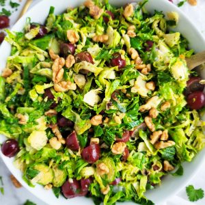 This Warm Grape, Brussels Sprouts, & Walnut Salad is the perfect combination of tangy, sweet and delicious, made with red California grapes, shredded Brussels sprouts, and walnuts. beautifuleatsandthings.com