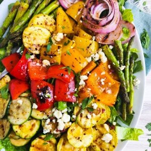 large white dish with salad of grilled vegetables on a wood surface beautifuleatsandthings.com