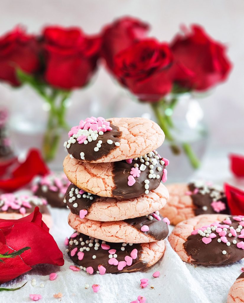 Strawberry cake mix crinkle cookies, dipped in milk chocolate, topped with pink & white sprinkles for Valentine's Day

beautifuleatsandthings.com