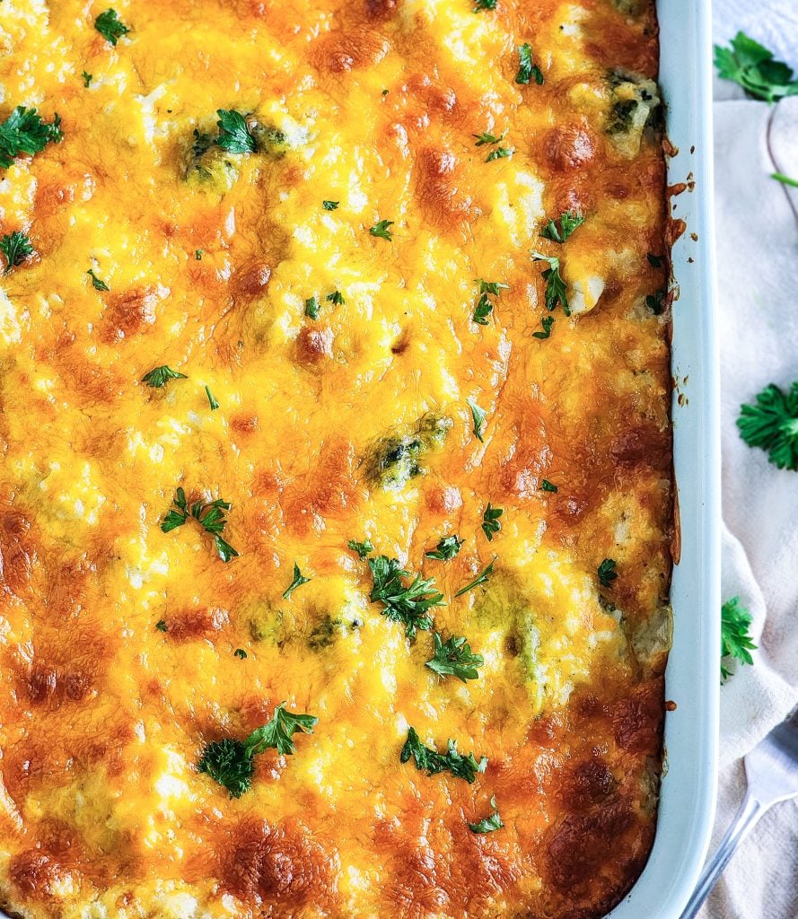 Budget-Friendly Cheesy Chicken & Broccoli Casserole for under $15 cooked in a light blue baking dish
beautifuleatsandthings.com
