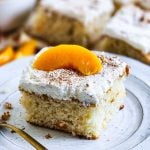 Light & Fluffy Peach Cake made with cake mix and whipped cream frosting and canned peaches beautifuleatsandthings.com