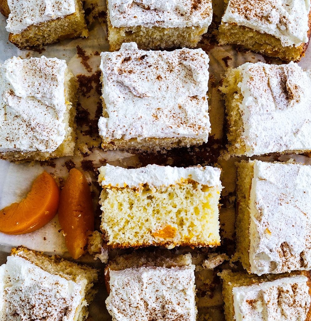 Light & Fluffy Peach Cake made with cake mix and whipped cream frosting and canned peaches
beautifuleatsandthings.com