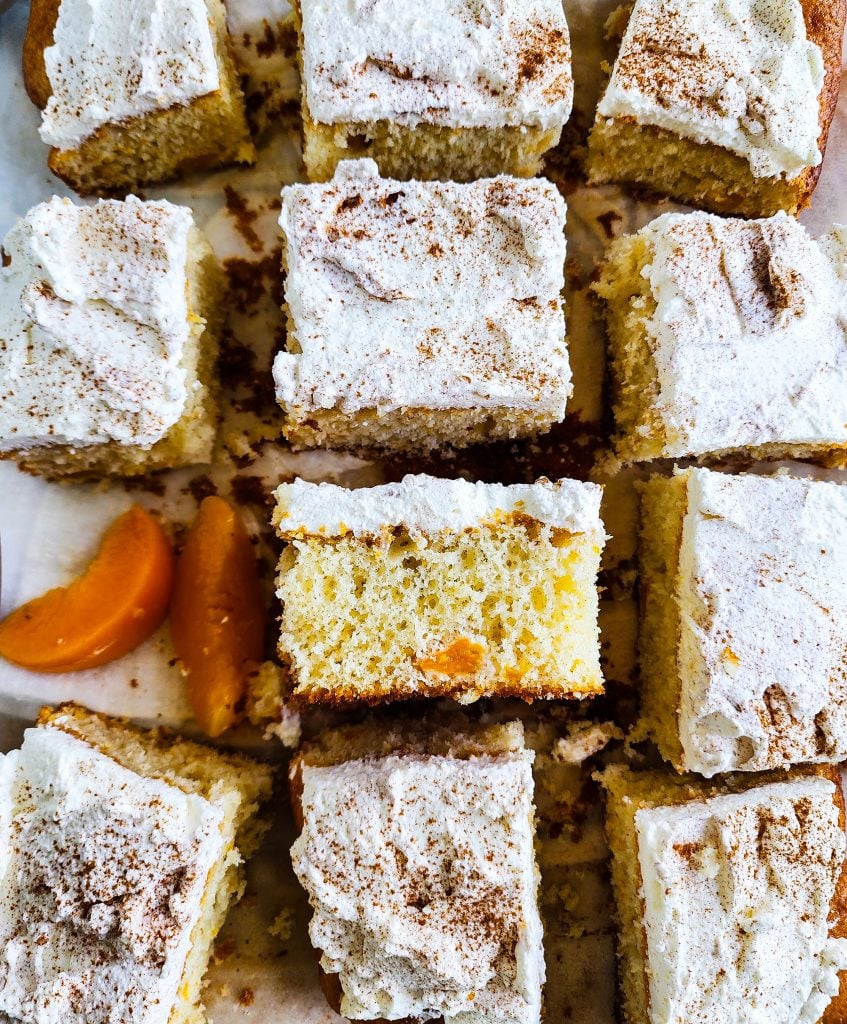 Light & Fluffy Peach Cake made with cake mix and whipped cream frosting and canned peaches beautifuleatsandthings.com