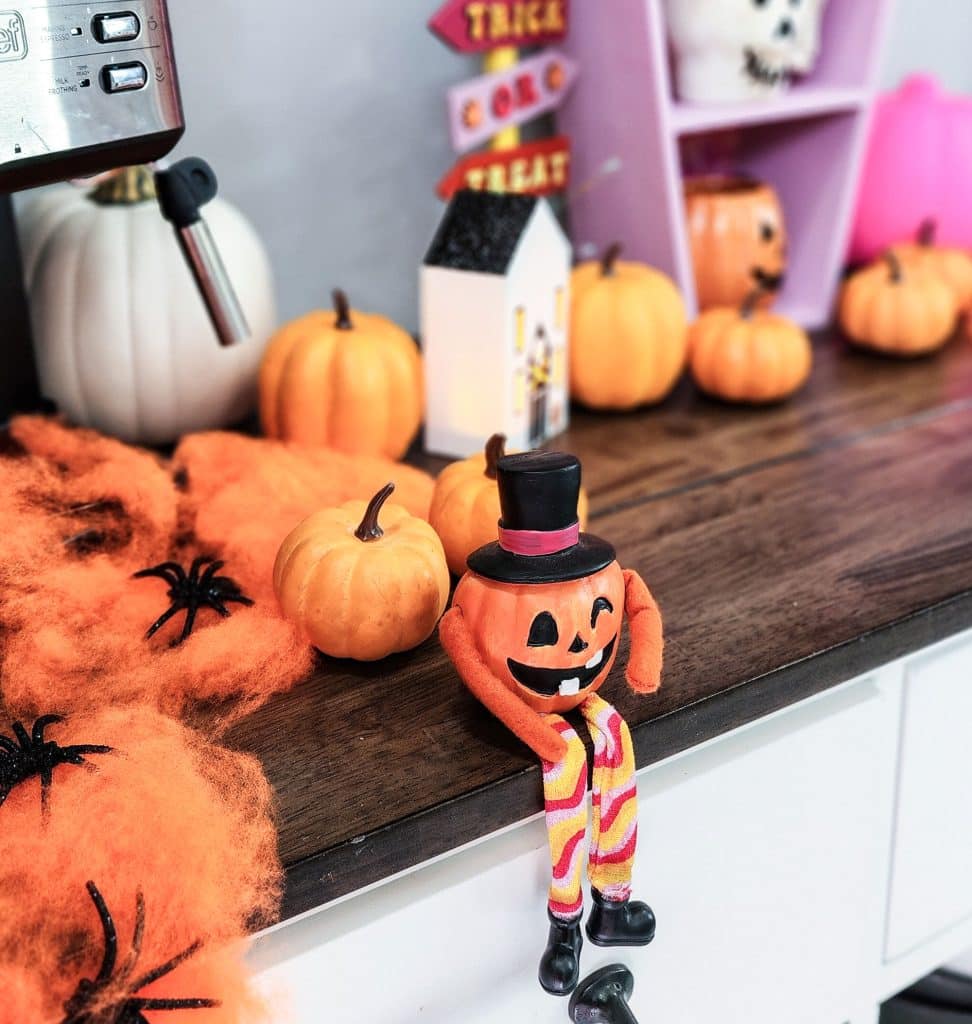 Groovy Halloween Coffee Bar or Boo Bar decorated with pink, orange, and purple bold colors
beautifuleatsandthings.com
