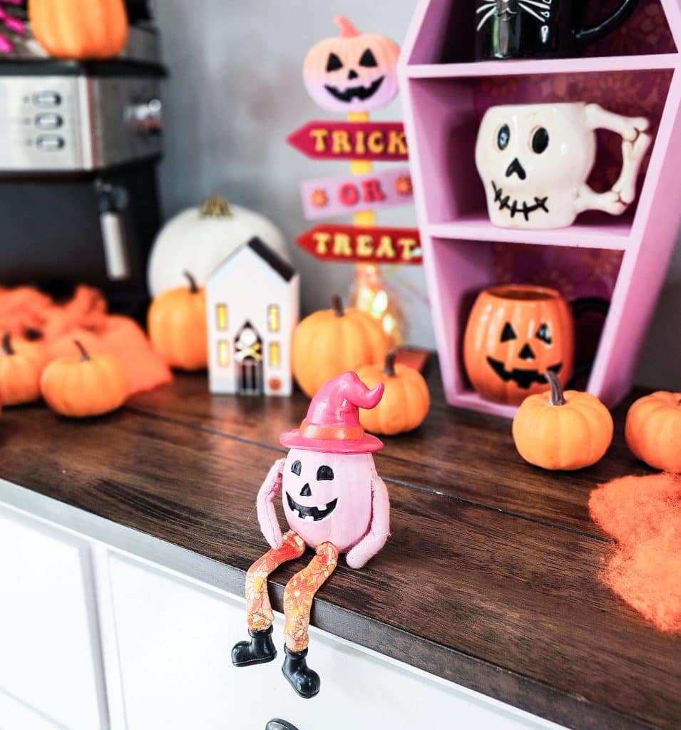 Groovy Halloween Coffee Bar or Boo Bar decorated with pink, orange, and purple bold colors
beautifuleatsandthings.com