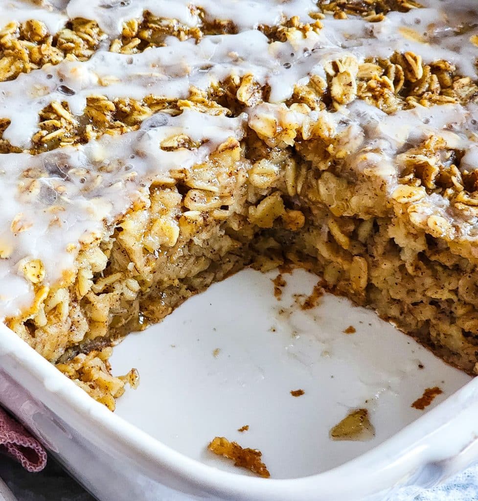 cinnamon roll baked oatmeal topped with a white icing, perfect for meal prep
beautifuleatsandthings.com