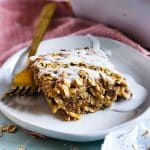 cinnamon roll baked oatmeal topped with a white icing, perfect for meal prep beautifuleatsandthings.com