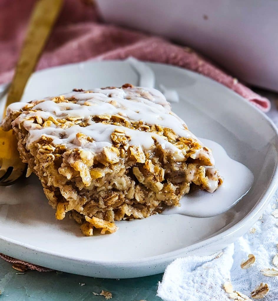 cinnamon roll baked oatmeal topped with a white icing, perfect for meal prep
beautifuleatsandthings.com