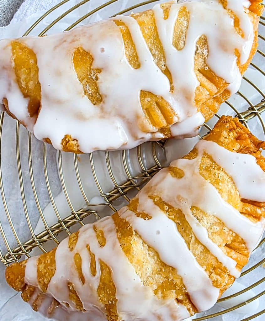 fried peach hand pies made with canned peaches and pre made pie dough, and powdered sugar icing
beautifuleatsandthings.com