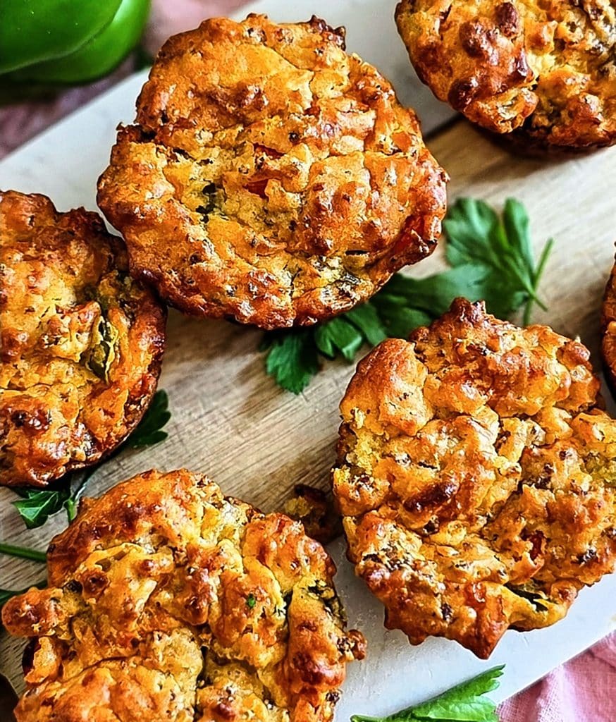 Cheesy Sausage Breakfast Muffins on a white cutting board, made with Bisquick
beautifuleatsandthings.com