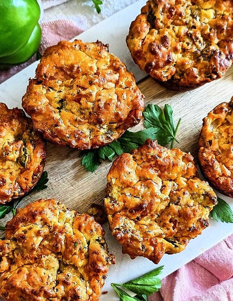 Cheesy Sausage Breakfast Muffins on a white cutting board, made with Bisquick
beautifuleatsandthings.com