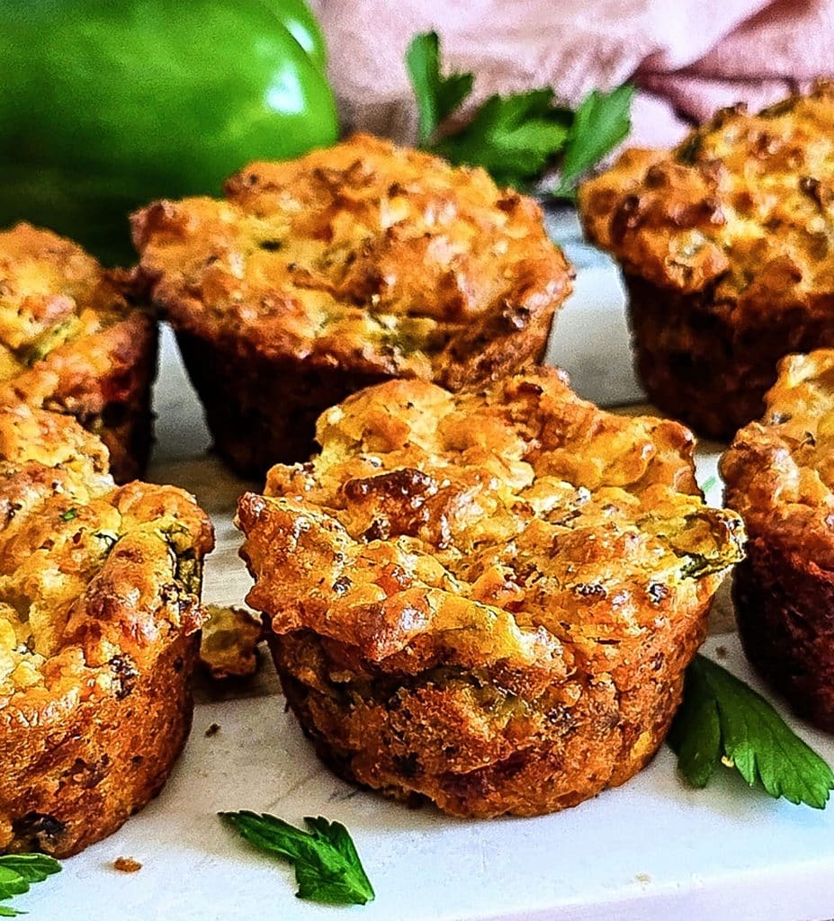Cheesy Sausage Breakfast Muffins on a white cutting board, made with Bisquick
beautifuleatsandthings.com