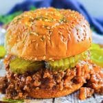 The best ever sloppy joe recipe that’s cheap and budget-friendly, perfect for busy families and kid-friendly, served on a toasted hamburger bun with pickles. Beautifuleatsandthings.com
