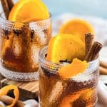 vanilla spice old fashioned cocktail in a lowball glass served with cinnamon sticks and orange slices beautifuleatsandthings.com