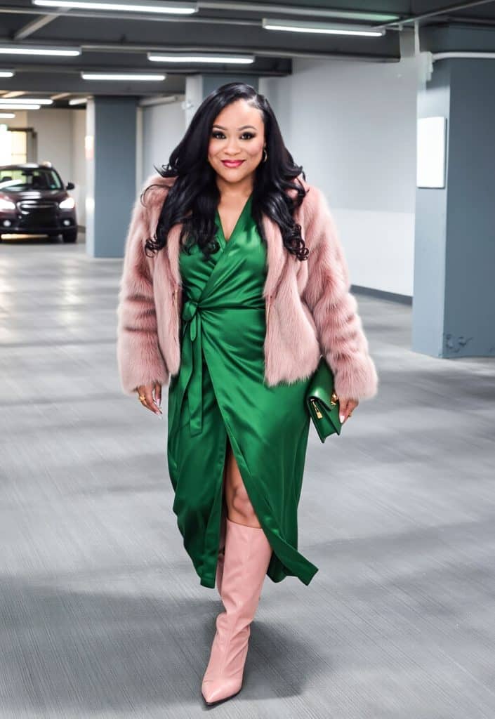 Affordable Holiday Outfits That Look Expensive-Plus Size Edition, Curvy Black Dietitian Shares tips on outfit inspo for the holidays-green wrap silk midi dress, pink faux fur coat, pink boots
beautifuleatsandthings.com