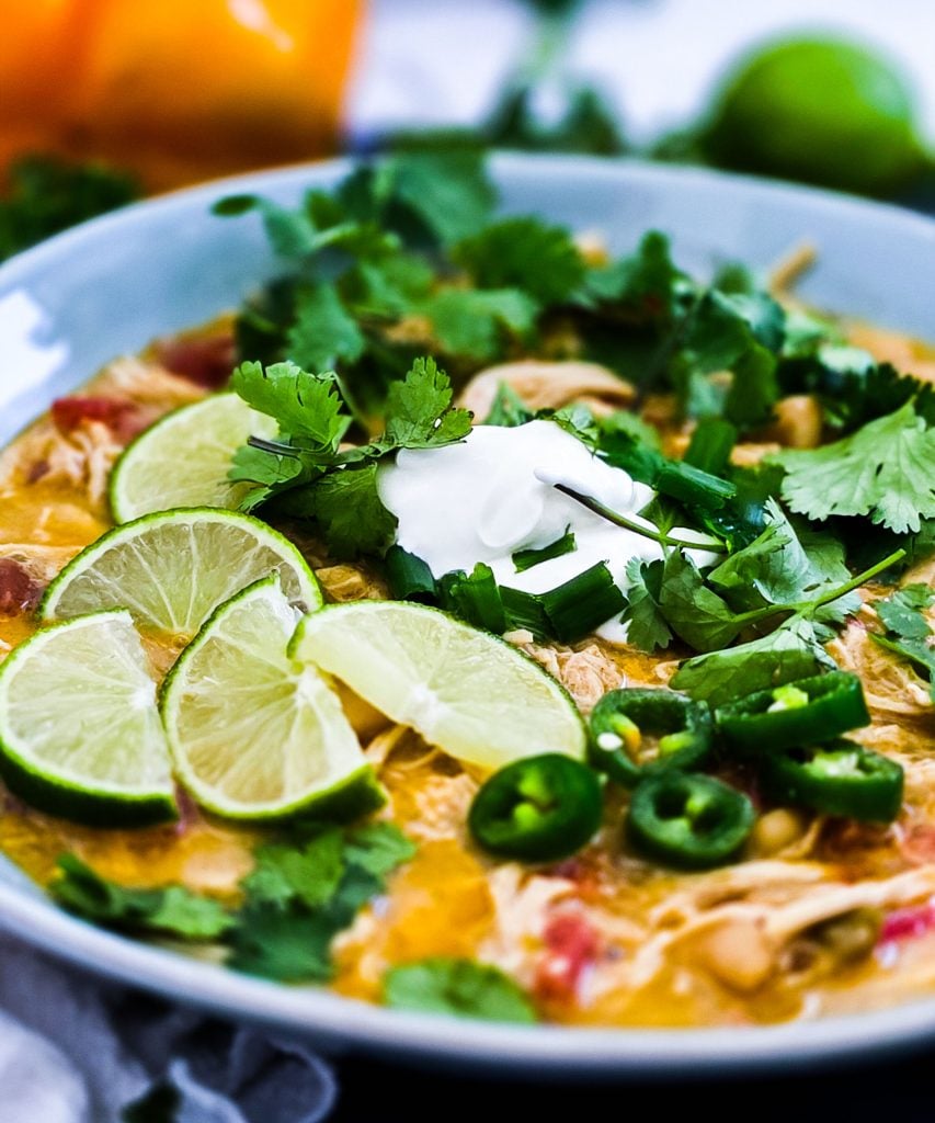 Slow Cooker Creamy White Chicken Chili (Crockpot Recipe) for busy weeknights, easy recipes for busy families, topped with cilantro, limes, sour cream and green onions
beautifuleatsandthings.com