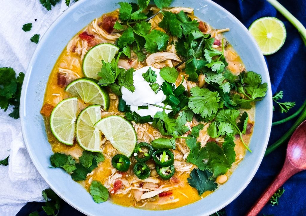 Slow Cooker Creamy White Chicken Chili (Crockpot Recipe) for busy weeknights, easy recipes for busy families, topped with cilantro, limes, sour cream and green onions
beautifuleatsandthings.com