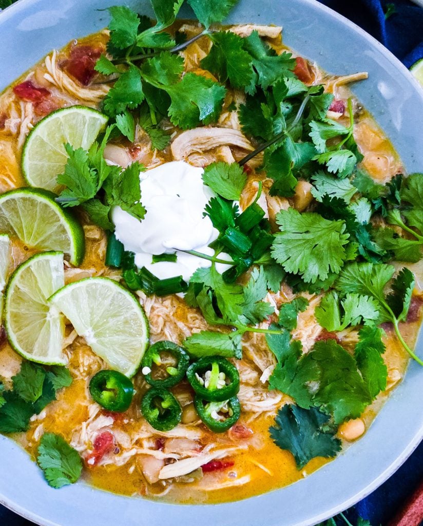 Slow Cooker Creamy White Chicken Chili (Crockpot Recipe) for busy weeknights, easy recipes for busy families, topped with cilantro, limes, sour cream and green onions
beautifuleatsandthings.com