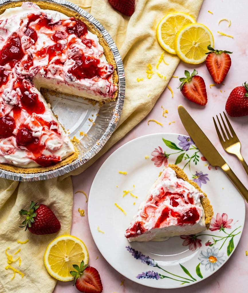 No bake strawberry lemon icebox pie with graham cracker crust on a pink marble surface beautifuleatsandthings.com