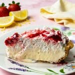 No bake strawberry lemon icebox pie with graham cracker crust on a pink marble surface beautifuleatsandthings.com
