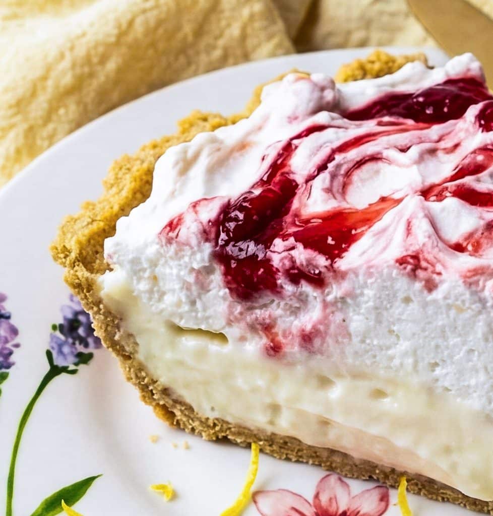 No bake strawberry lemon icebox pie with graham cracker crust on a pink marble surface
beautifuleatsandthings.com