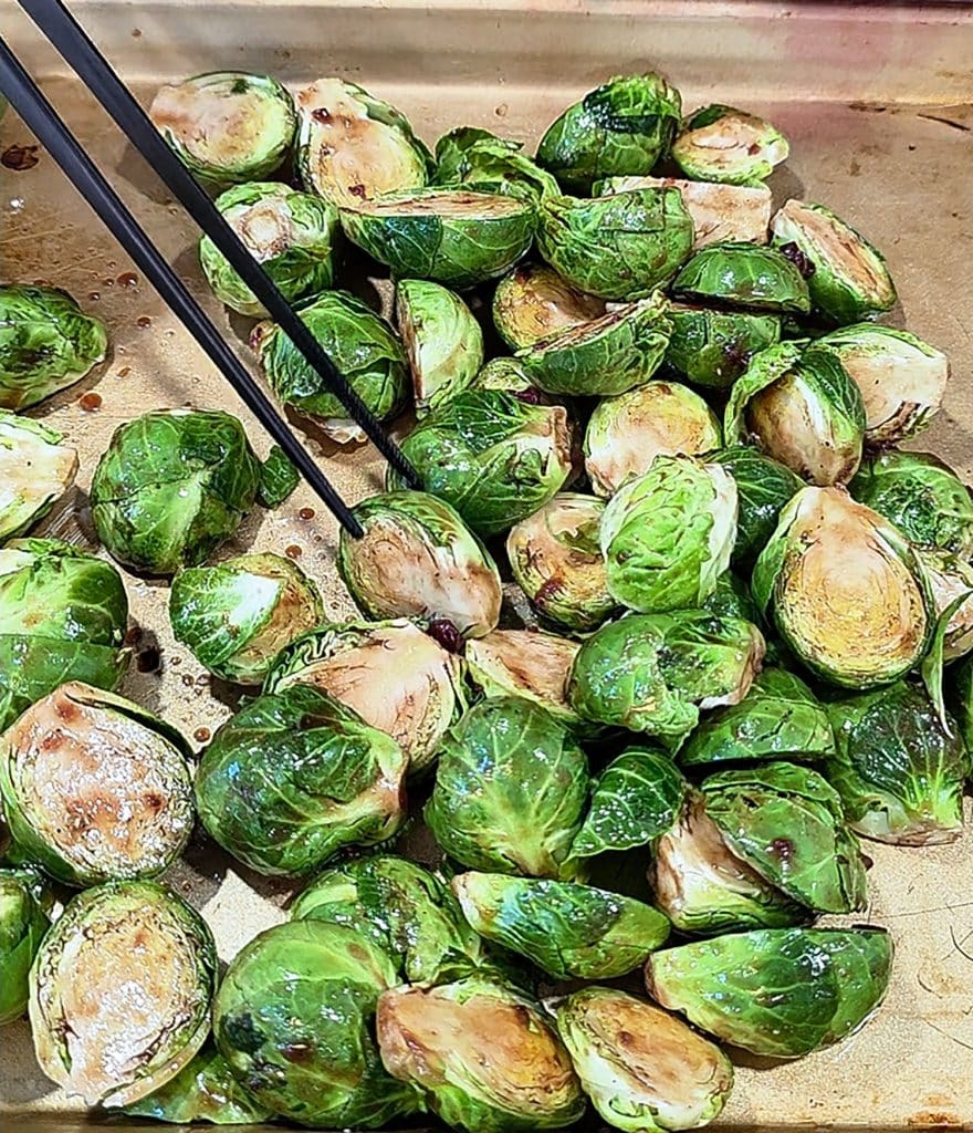 Crispy Oven Roasted Brussels Sprouts with Strawberry Lemonade Flavor, in a white bowl with crumbled feta cheese
beautifuleatsandthings.com