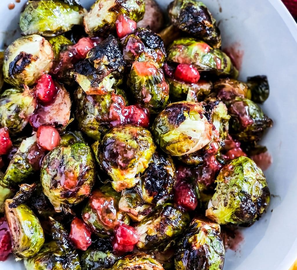 Crispy Oven Roasted Brussels Sprouts with Strawberry Lemonade Flavor, in a white bowl with crumbled feta cheese
beautifuleatsandthings.com