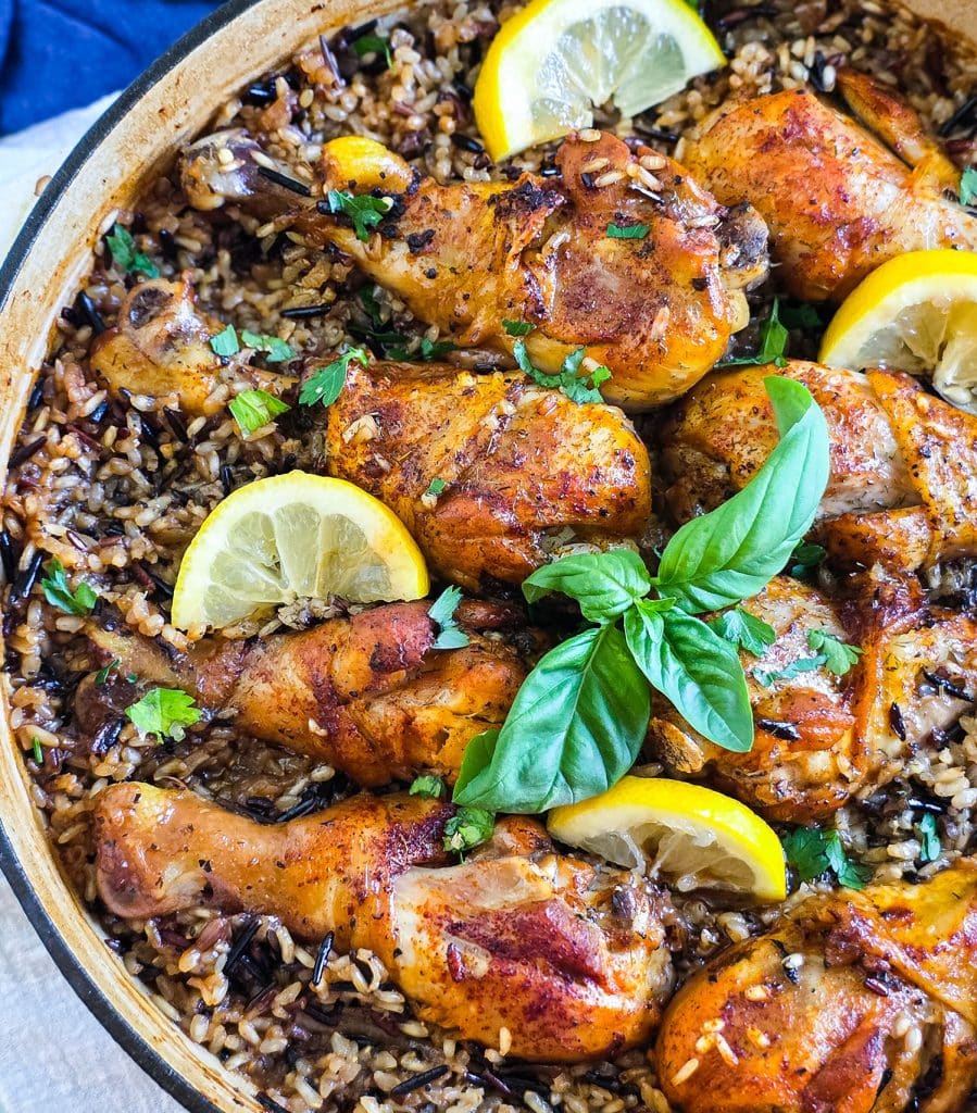 One pot lemon basil chicken with wild rice in skillet garnished with fresh basil and lemon slices
beautifuleatsandthings.com
