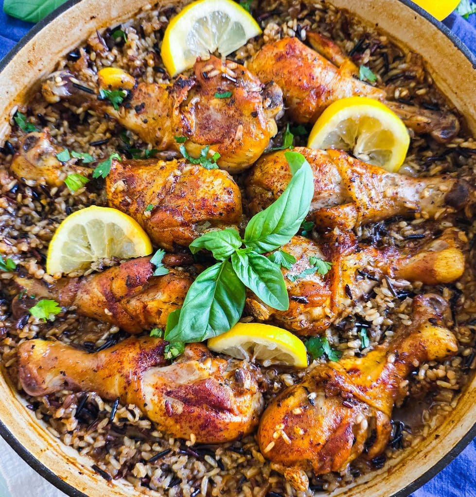 One pot lemon basil chicken with wild rice in skillet garnished with fresh basil and lemon slices beautifuleatsandthings.com